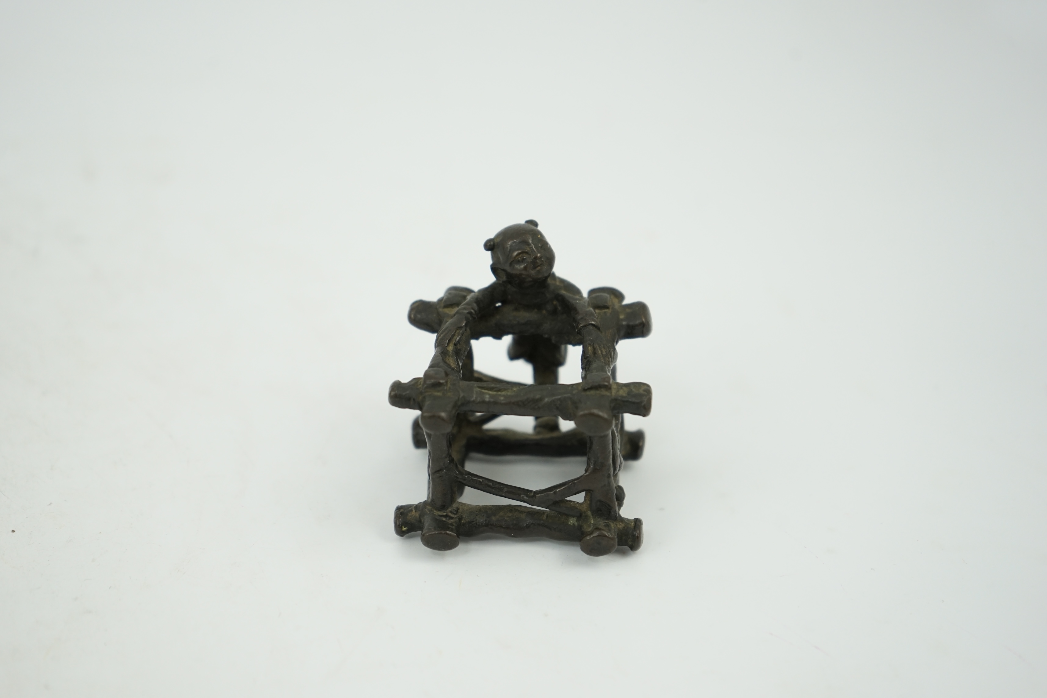 A Chinese bronze figural scroll weight, late Ming